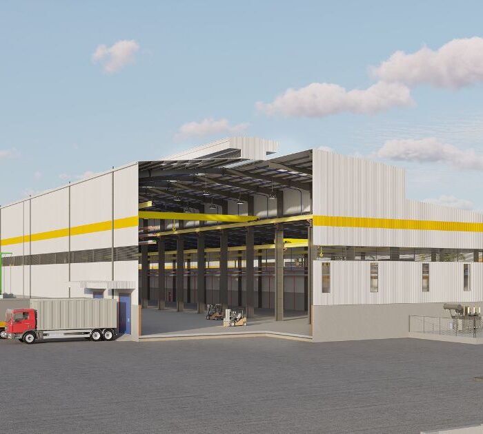Industrial facility exterior with trucks and open bay, illustrating streamlined project execution phases