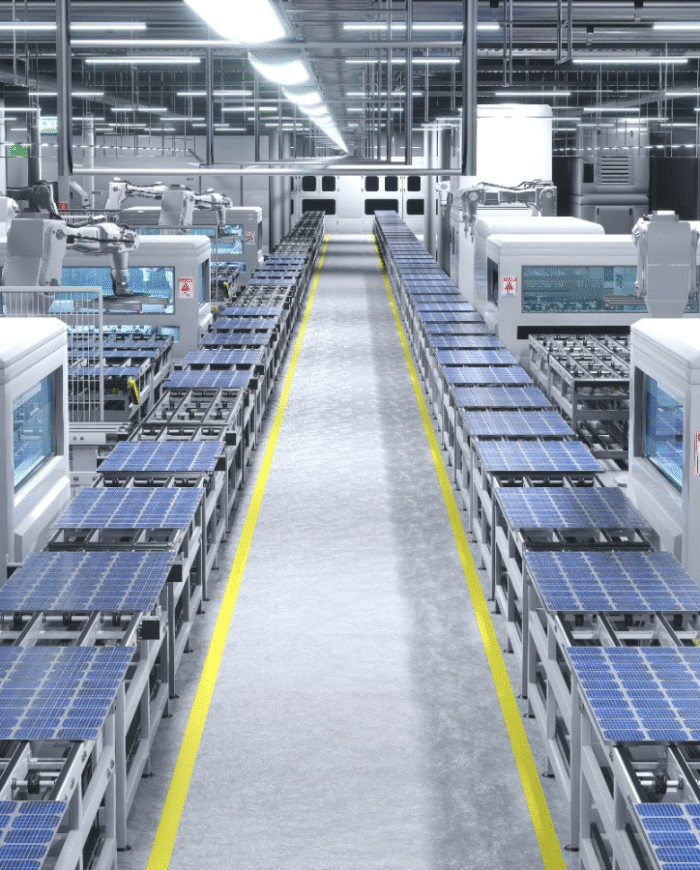 High-tech solar factory in India showing robotic arms assembling panels on a modern production line